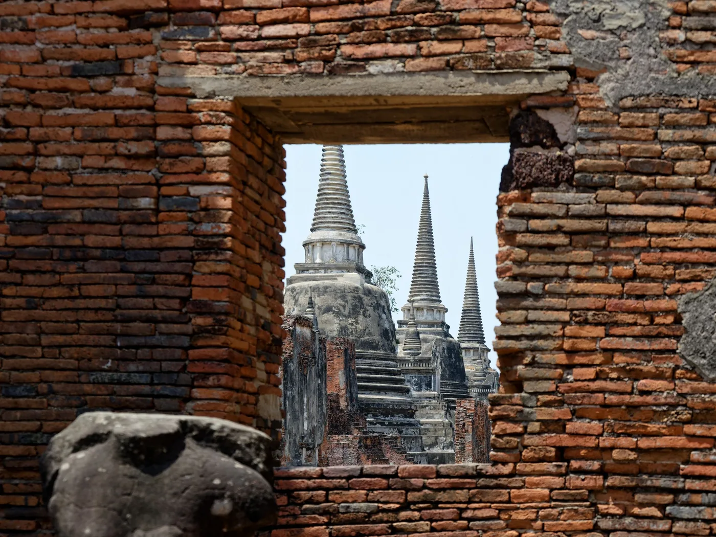 Rows of bell-shaped brick chedis at Ayutthaya